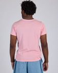 Jr. Varsity Tee in Baby Pink back view on Isaac