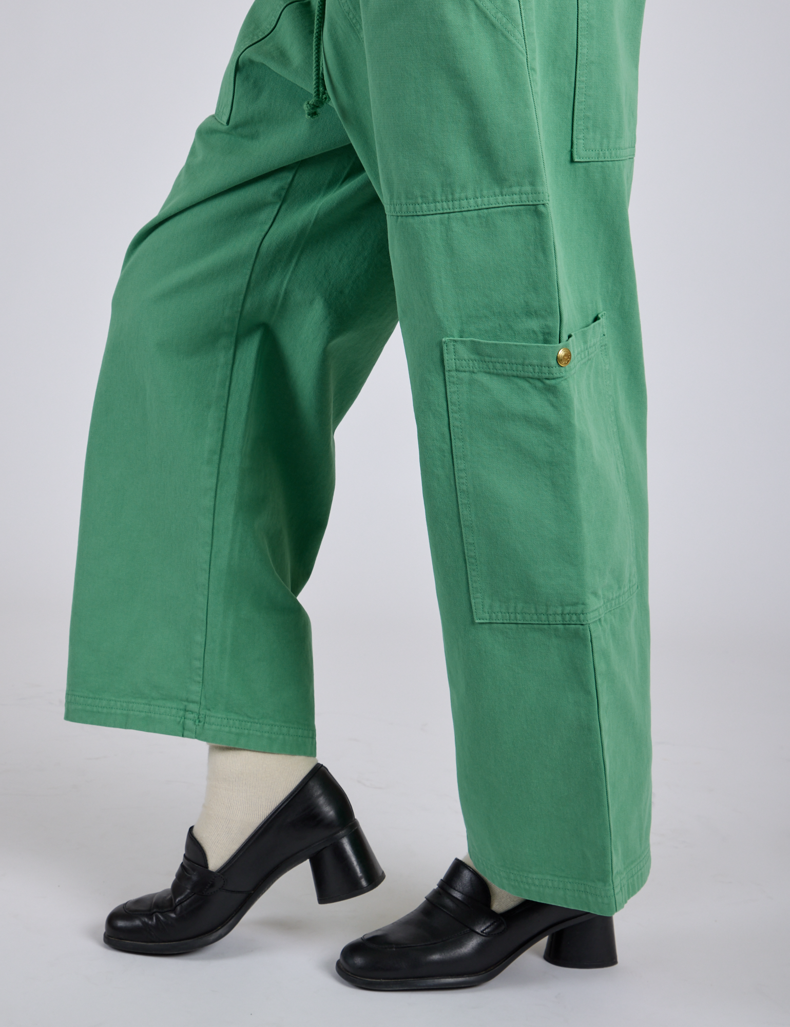 Side view pant leg close up of Drop Pocket Cargo Pants in Seafoam Green on Kira