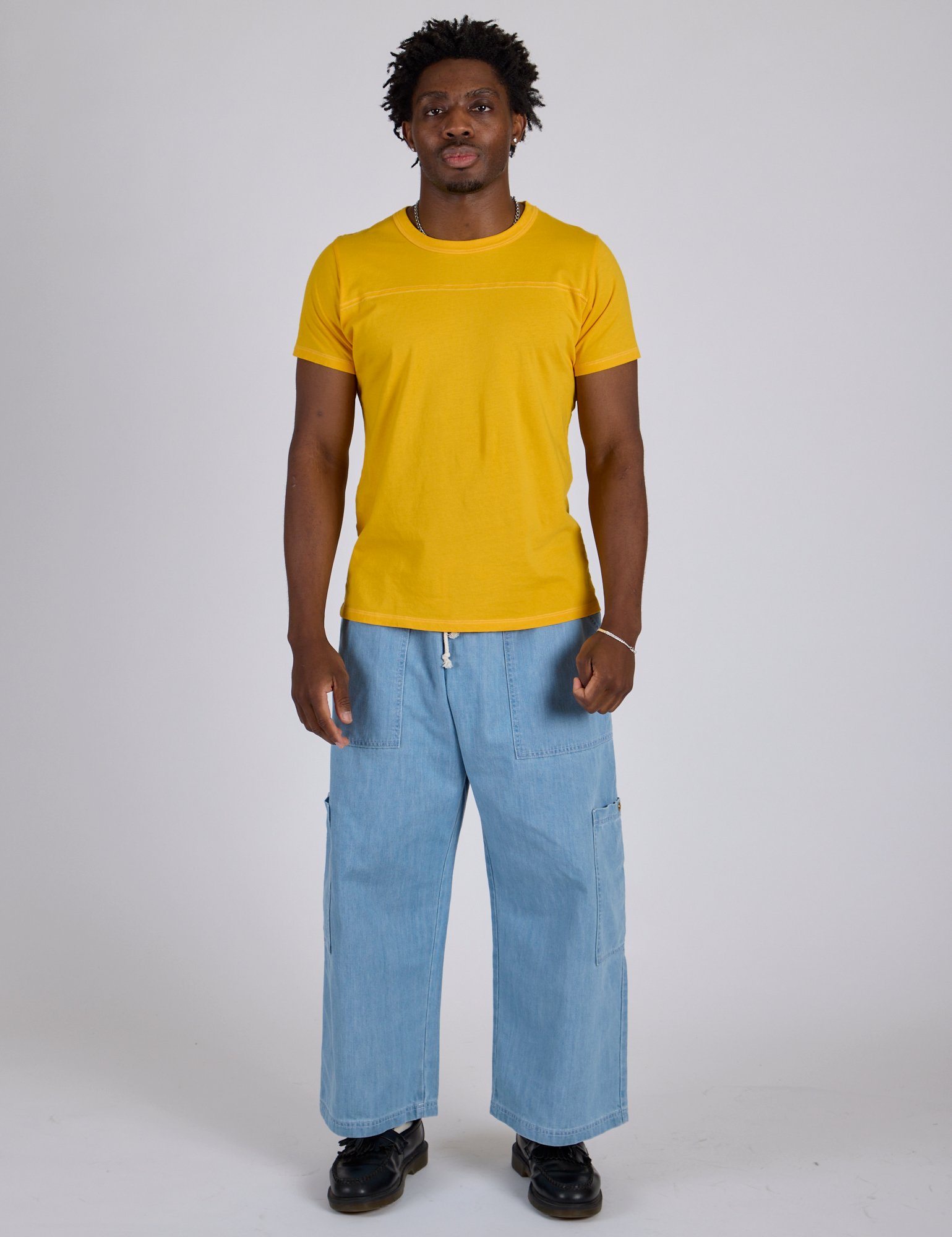 Jr. Varsity Tee in Sunshine Yellow and light wash Denim Drop Pocket Pants on Isaac