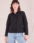 Alex is wearing a buttoned up Ripstop Work Jacket in Basic Black