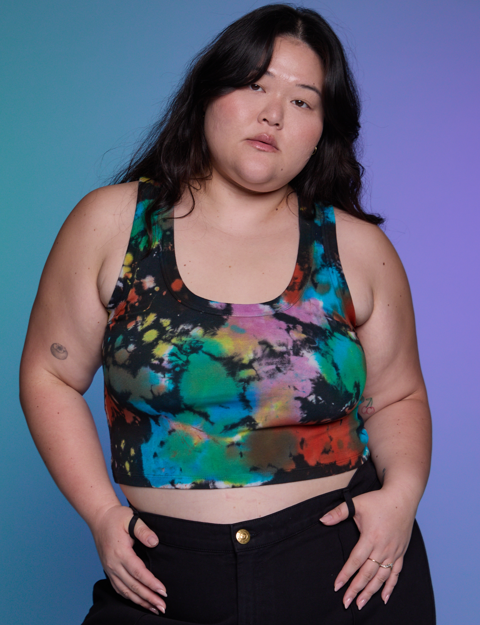 Ashley is 5&#39;7&quot; and wearing L Rainbow Magic Waters Cropped Tank