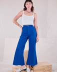 Alex is 5'8" and wearing XXS Bell Bottoms in Royal Blue paired with Cami in Vintage Tee Off-White