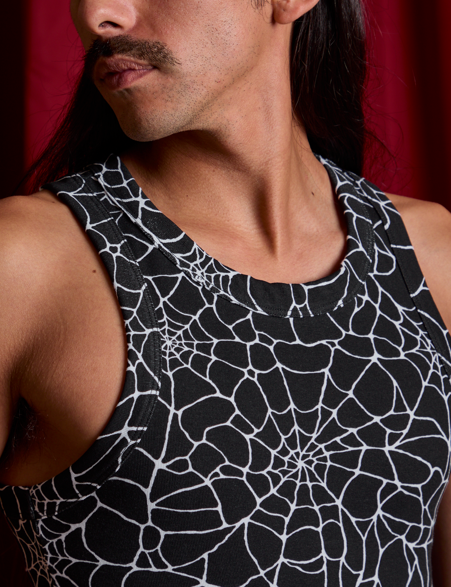 Front close up of Spider Webs Racerback Tank on Anthony
