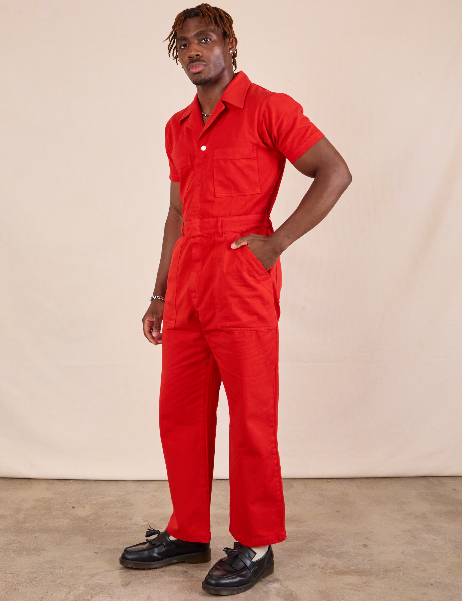 Short Sleeve Jumpsuit in Mustang Red angled front view on Issac