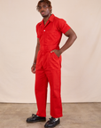 Short Sleeve Jumpsuit in Mustang Red angled front view on Issac