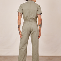 Back view of Short Sleeve Jumpsuit in Khaki Grey worn by Jesse