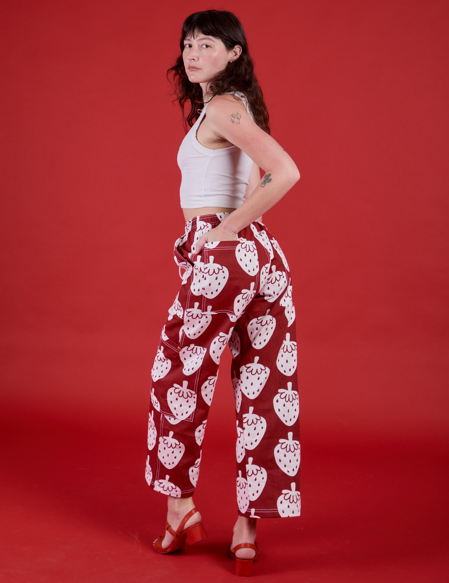 Angled back view of Drop Pocket Pants in Strawbaby on Alex