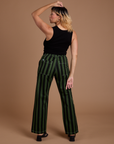 Back view of Black Stripe Work Pants in Evergreen and black Cropped Tank on Tiara