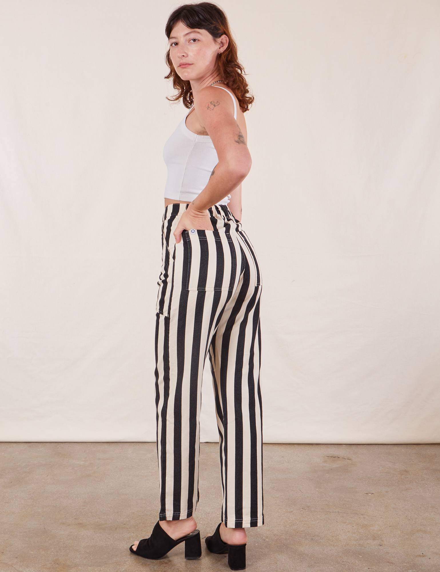 Angled back view of Black Striped Work Pants in White on Alex
