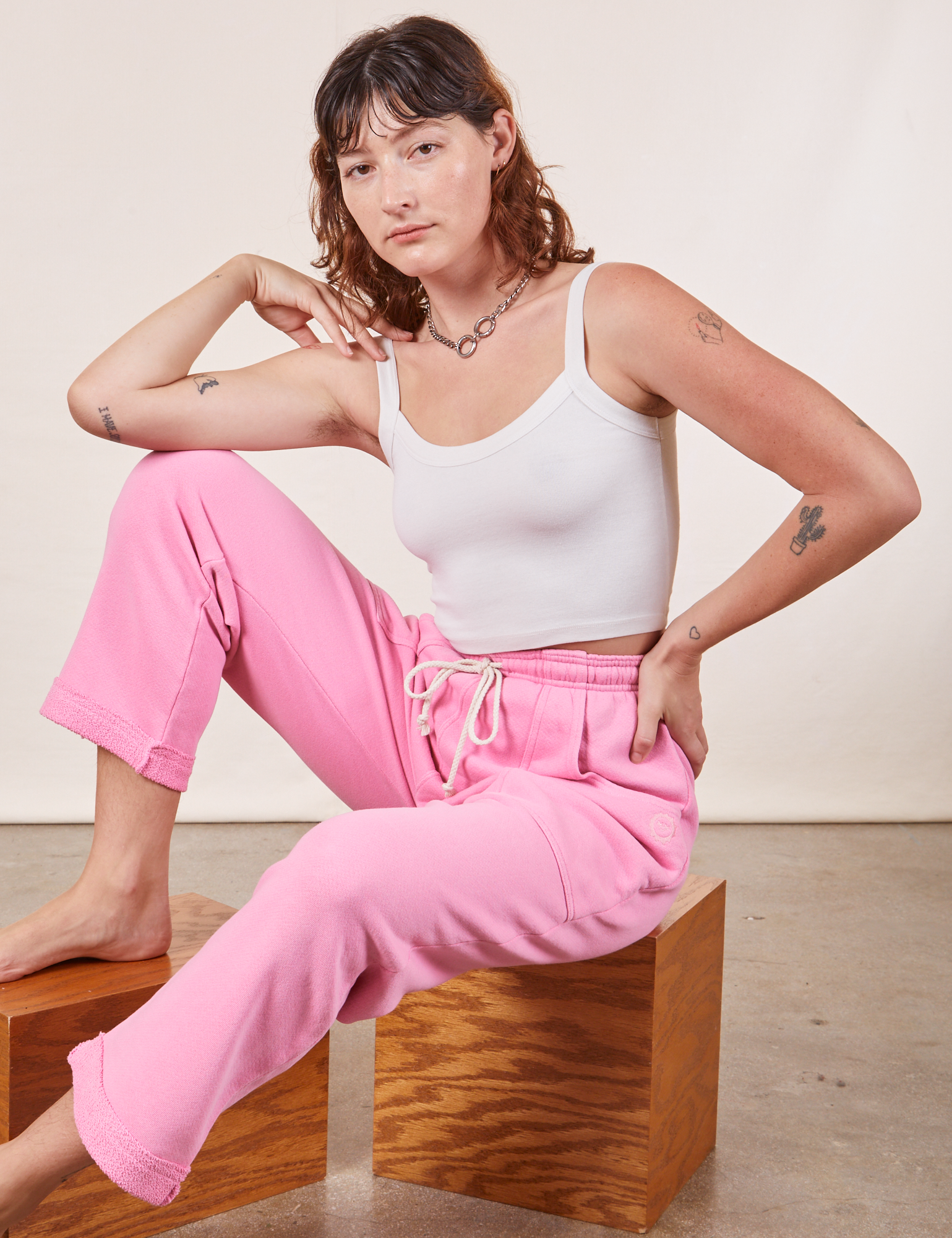 Alex is wearing Cropped Rolled Cuff Sweatpants in Bubblegum Pink and vintage off-white Cami