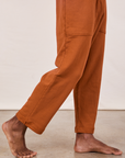 Cropped Rolled Cuff Sweatpants in Burnt Terracotta pant leg side view close up on Jerrod
