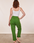 Back view of Cropped Rolled Cuff Sweatpants in Lawn Green and vintage off-white Cami on Alex