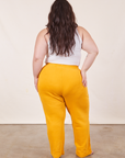 Back view of Cropped Rolled Cuff Sweatpants in Mustard Yellow on Ashley