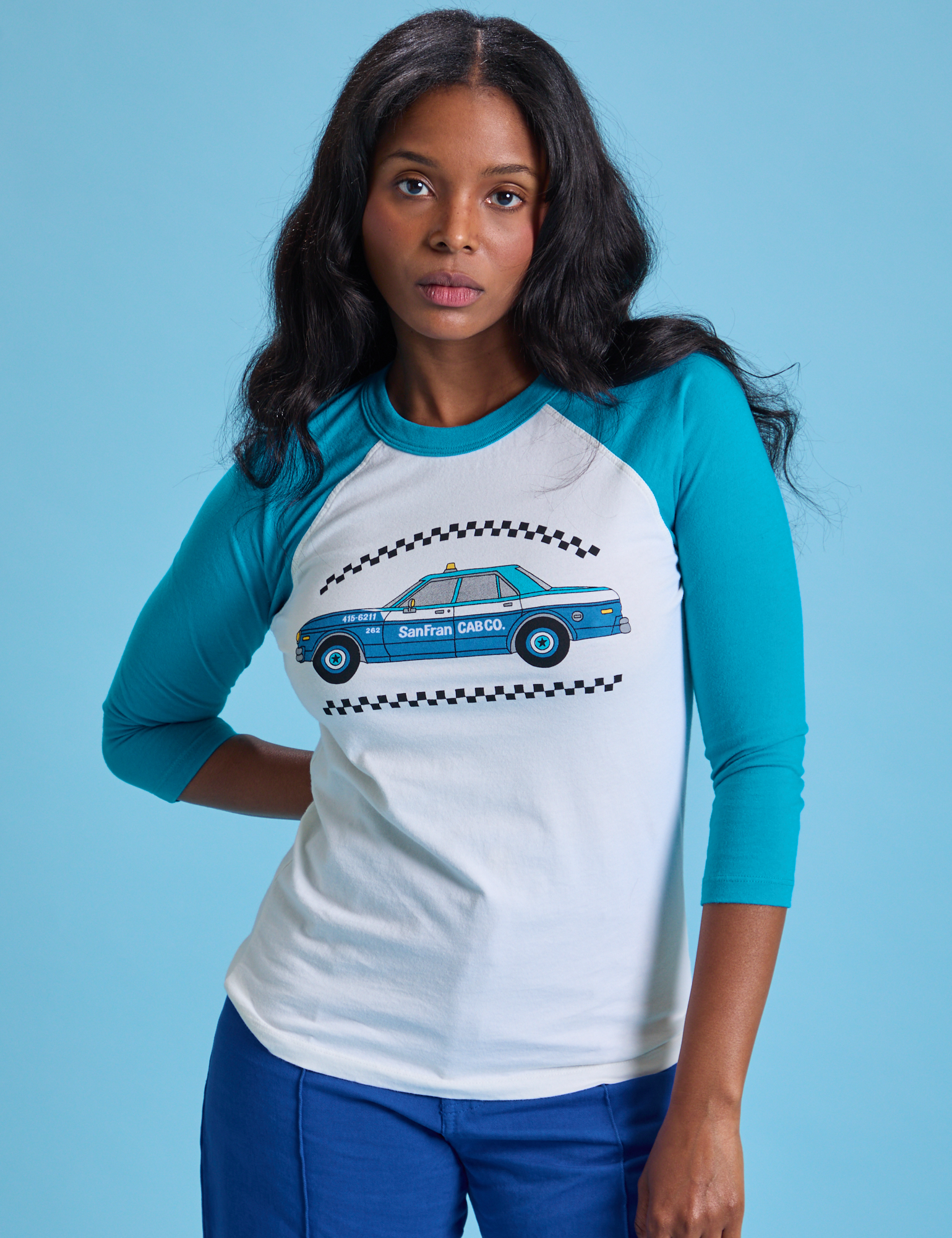 Kandia is 5&#39;3&quot; and wearing XS Taxi Raglan Tee in San Francisco