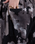 Close up of Sydney's hand in the back pocket of Magic Waters Drop Pocket Pants in Ink Blot