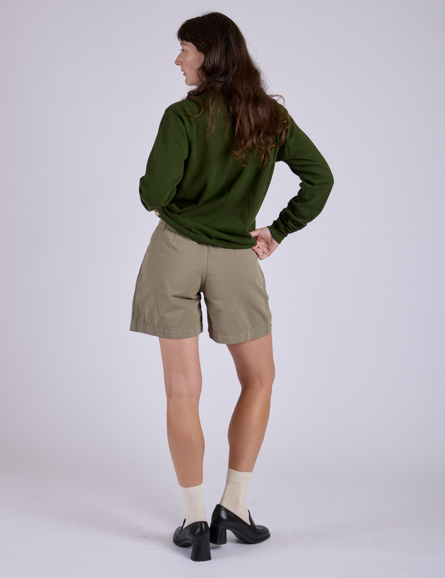 Back view of Pleated Trouser Shorts in Khaki Grey and evergreen Long Sleeve Burly Tee