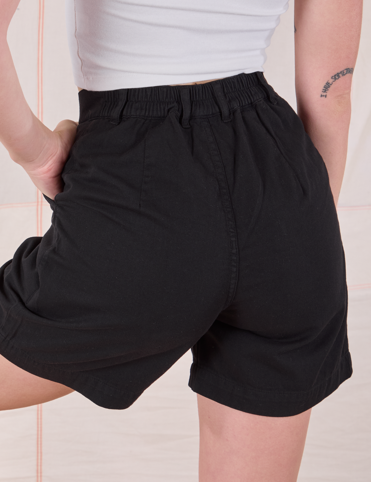 Trouser Shorts in Basic Black back close up on Alex