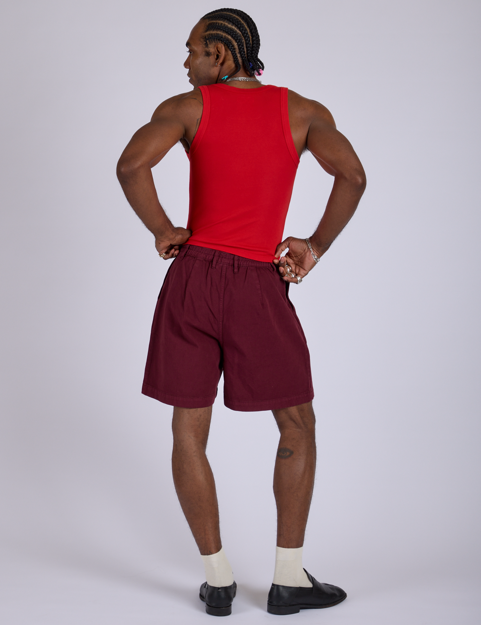 Back view of Pleated Trouser Shorts in Red Wine and mustang red Cropped Tank 