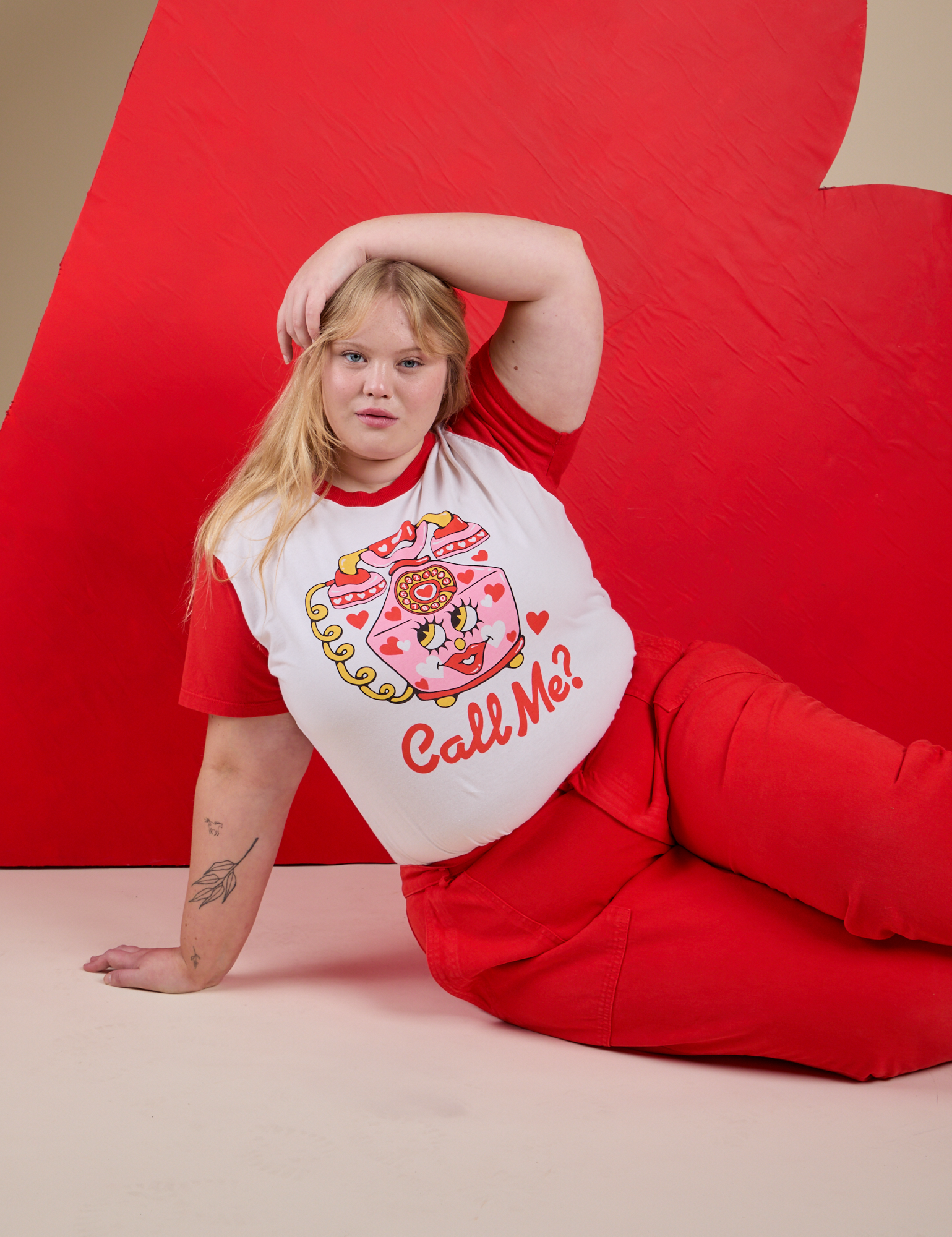 Juliet is wearing Vintage Tee in Call Me and mustang red WorK Pants
