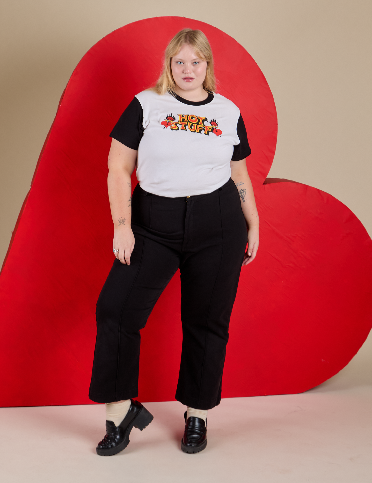 Juliet is 5’7” and wearing L Vintage Tee in Hot Stuff tucked into black Western Pants