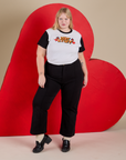 Juliet is 5’7” and wearing L Vintage Tee in Hot Stuff tucked into black Western Pants