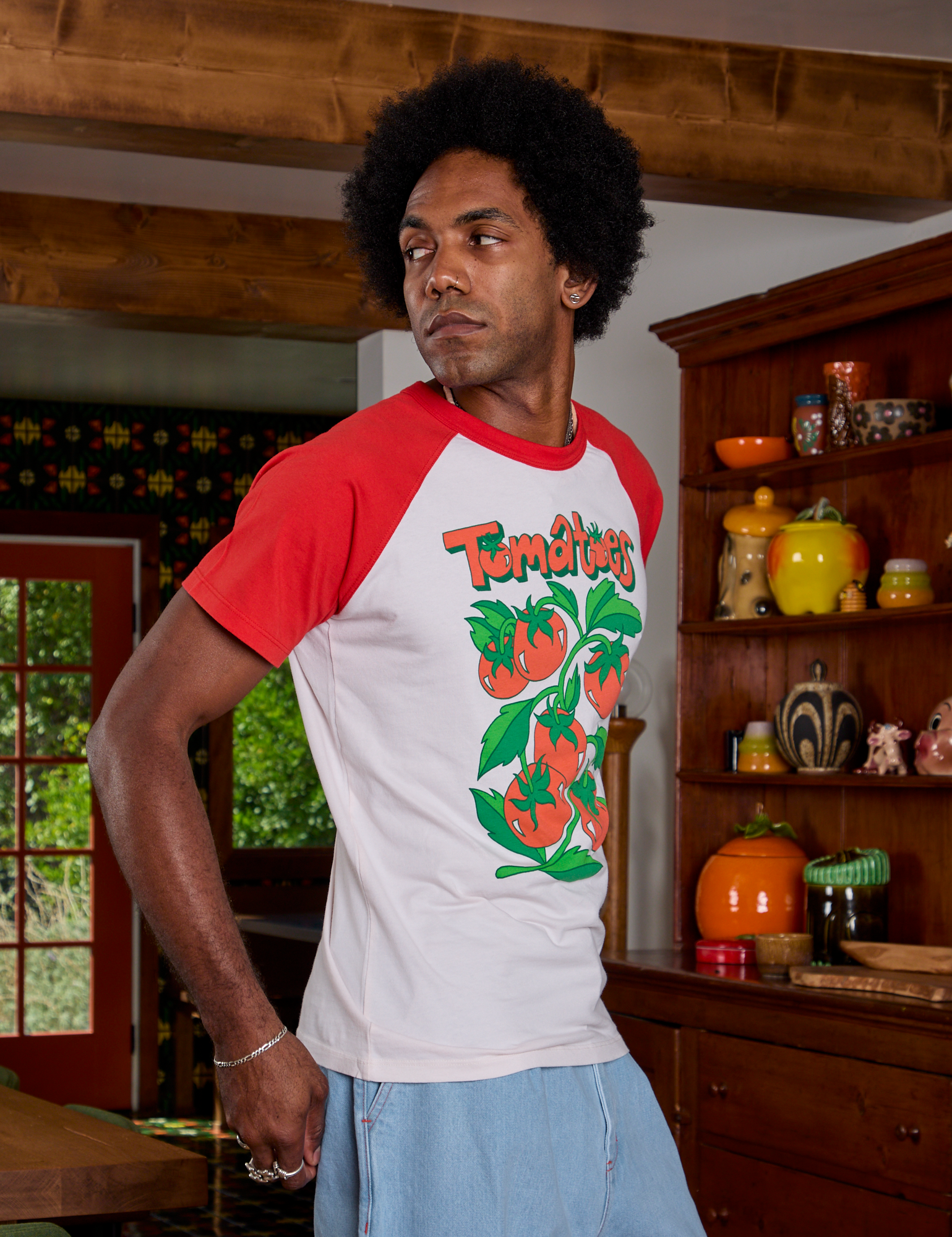 Side view of Short Sleeve Raglan Tee in Tomatoes on Jerrod