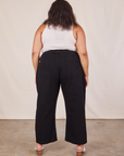 Back view of Western Pants in Basic Black and vintage off-white Tank Top worn by Alicia