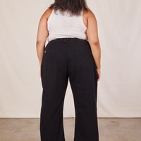 Back view of Western Pants in Basic Black and vintage off-white Tank Top worn by Alicia