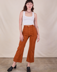 Alex is 5'8" and wearing XS Western Pants in Burnt Terracotta paired with a Cropped Tank in Vintage Tee Off-White