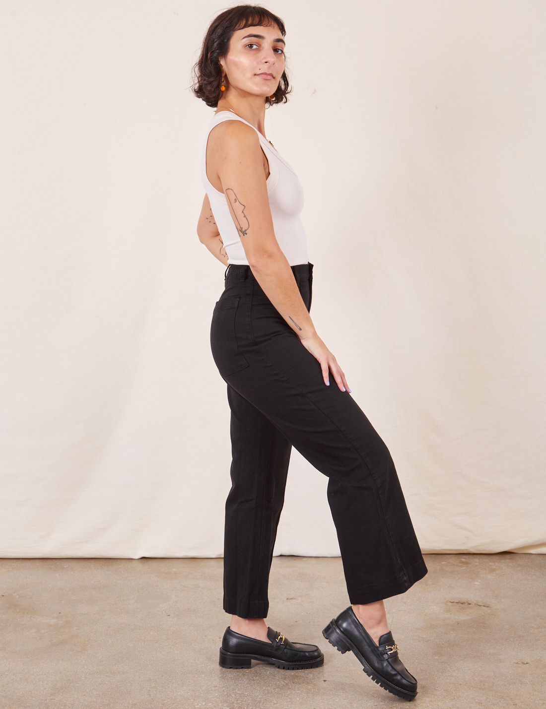 Western Pants in Basic Black side view on Soraya wearing a vintage off-white Tank Top