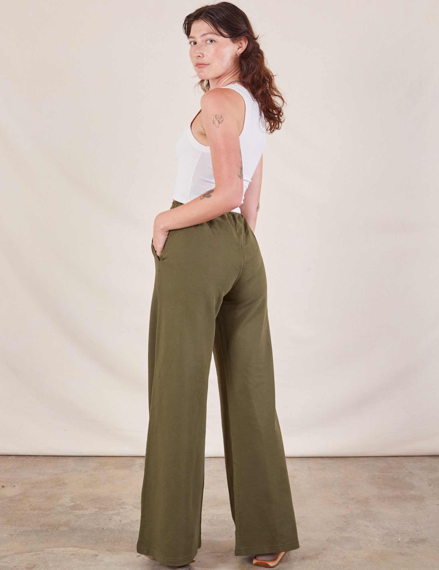 Wide Leg Sweat Pants in Surplus Green angled back view on Alex