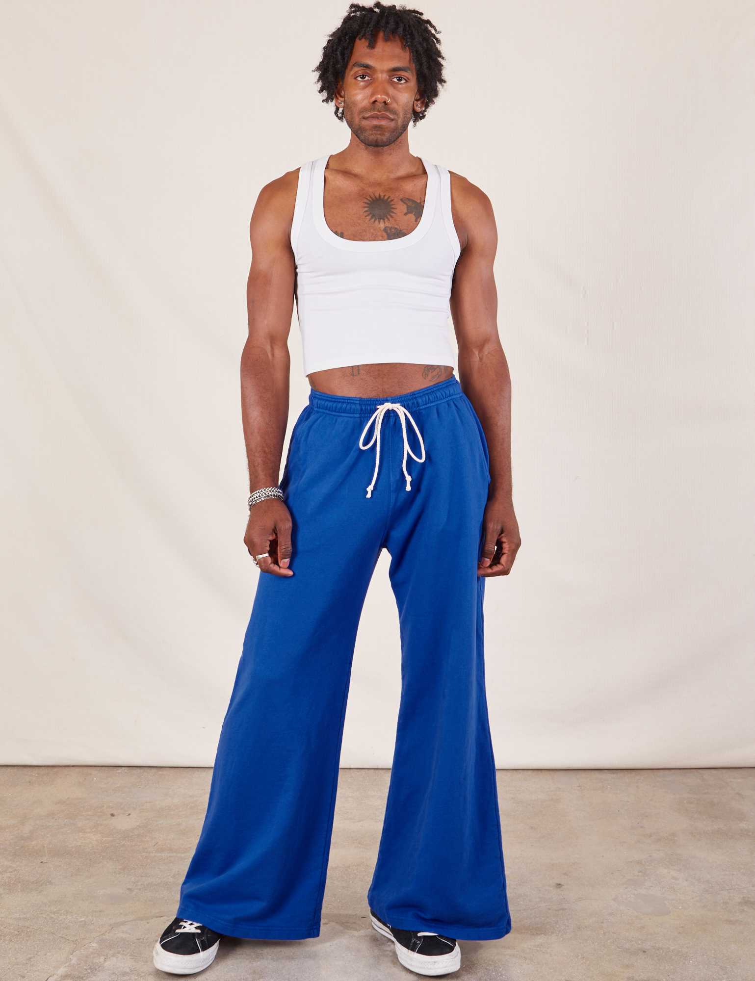 Jerrod is 6&#39;3&quot; and wearing S Wide Leg Sweat Pants in Royal Blue paired with vintage tee off-white