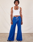 Jerrod is 6'3" and wearing S Wide Leg Sweat Pants in Royal Blue paired with vintage tee off-white