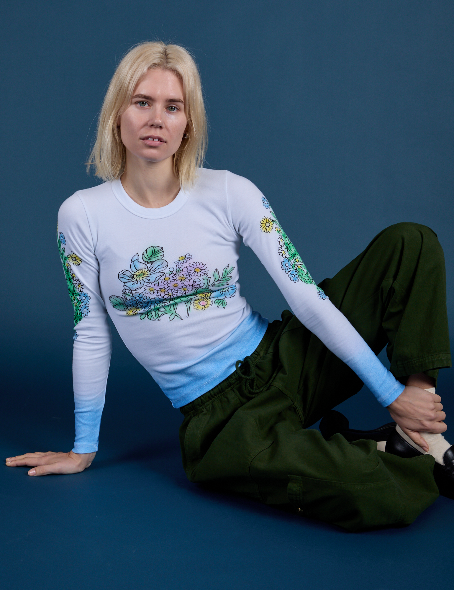 Floral Long Sleeve Baby Tee in Baby Blue and evergreen Drop Pocket Cargo Pants on Madeline