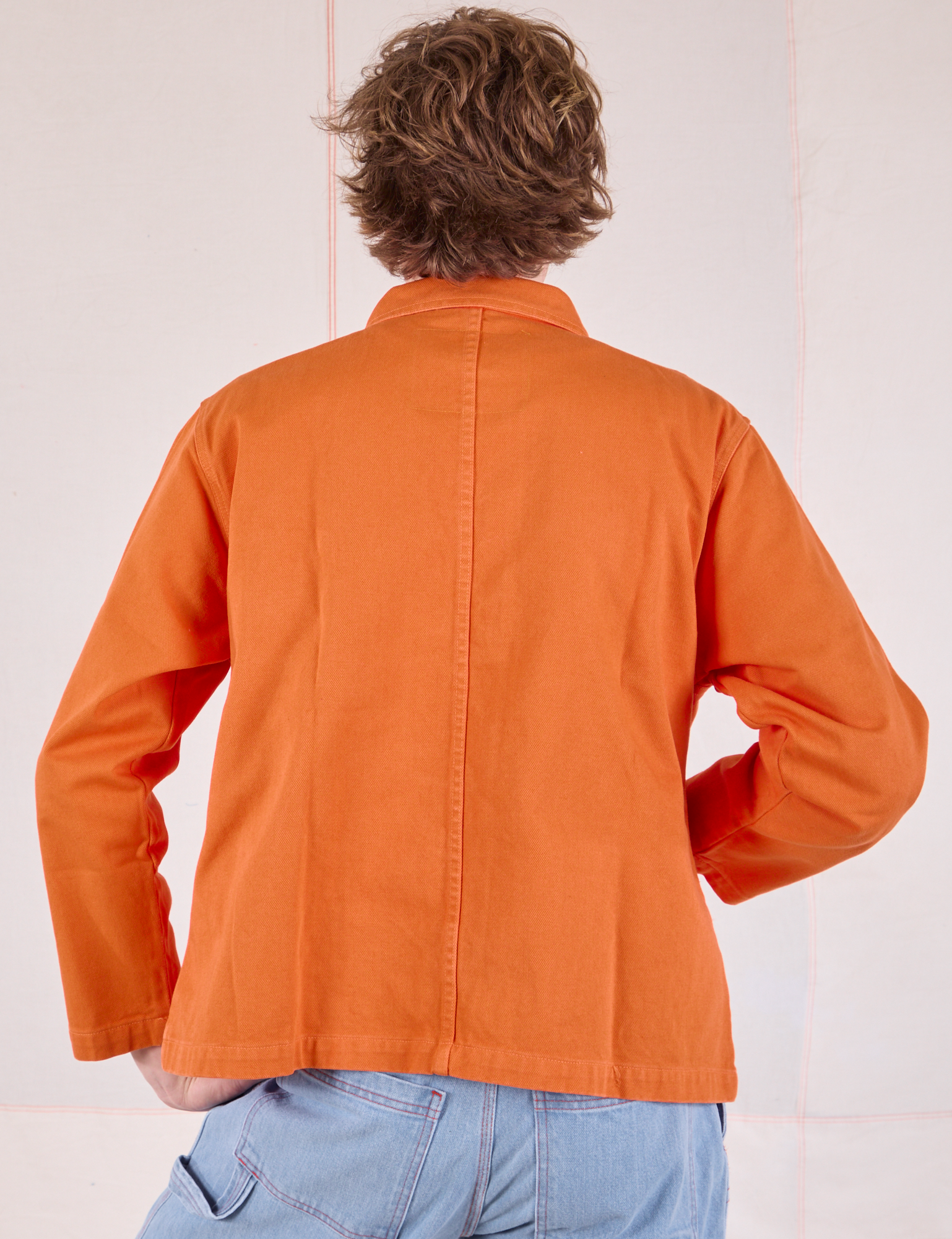 Denim Work Jacket in Construction Orange back view on Quinn