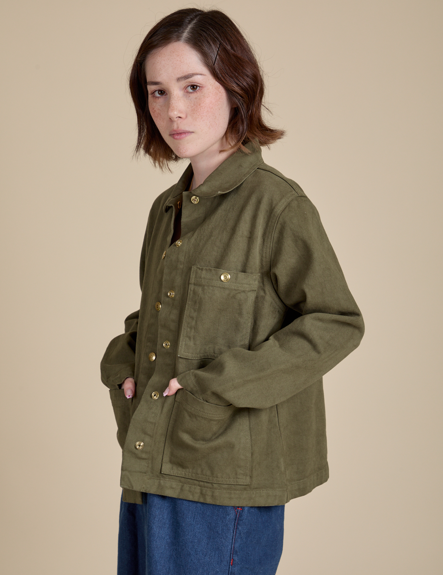 Denim Work Jacket in Surplus Green side view on Hana