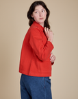 Side view of Denim Work Jacket in Mustang Red on Alex
