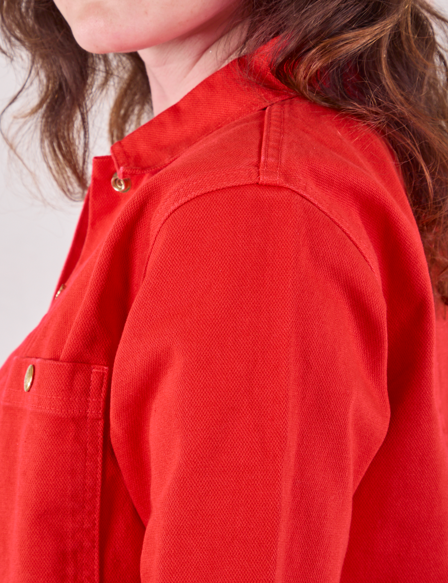 Denim Work Jacket in Mustang Red side shoulder close up on Alex