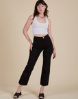 Alex is 5’8” and wearing XS Work Pants in Basic Black paired with a Cropped Tank in Vintage Tee White