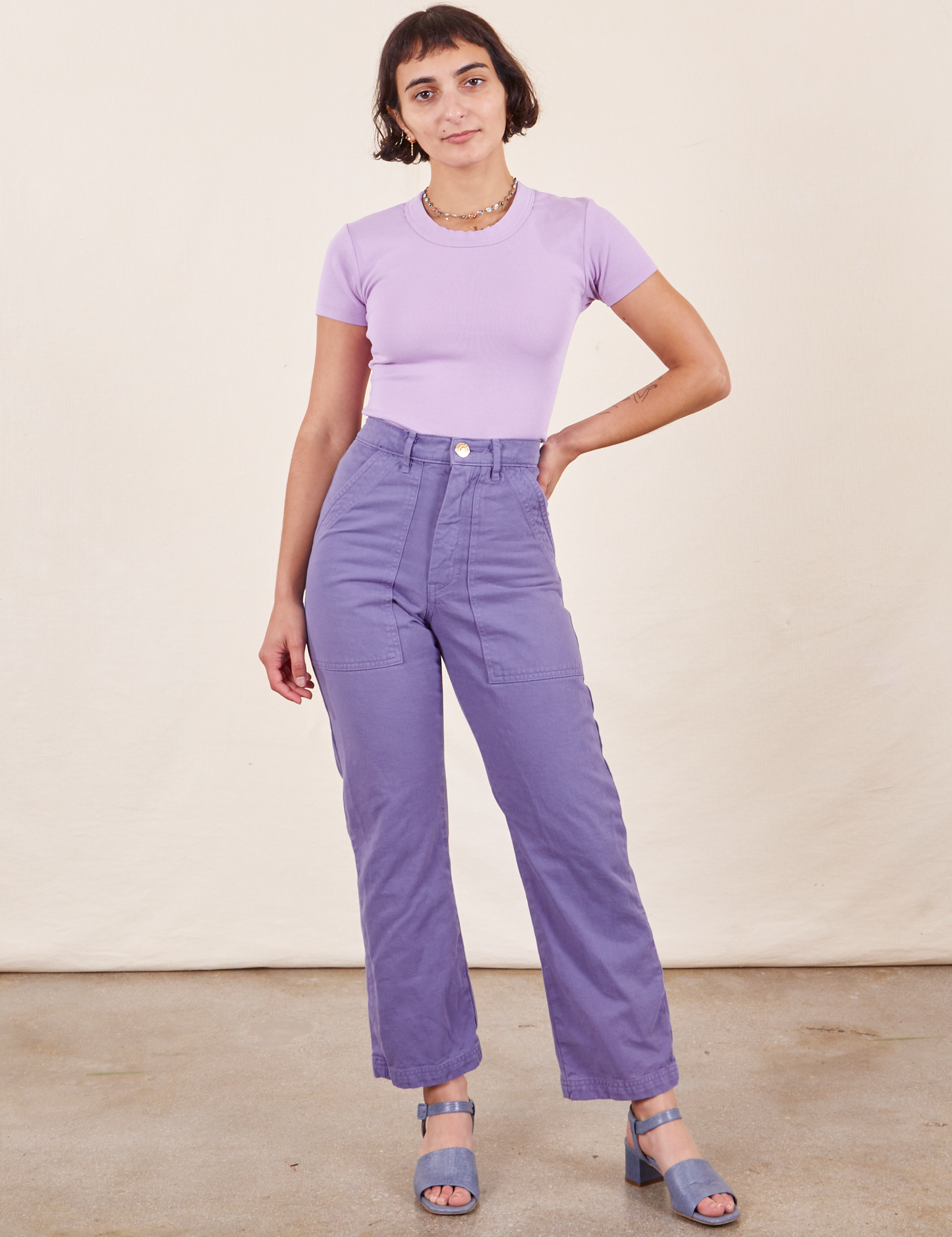 Soraya is 5&#39;2&quot; and wearing Petite XXS Work Pants in Faded Grape paired with lilac purple Baby Tee