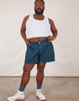 Elijah is 6’0” and wearing 3XL Classic Work Shorts in Lagoon paired with a Tank Top in vintage tee off-white 