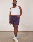 Elijah is 6’0” and wearing 3XL Classic Work Shorts in Nebula Purple paired with Tank Top in vintage tee off-white