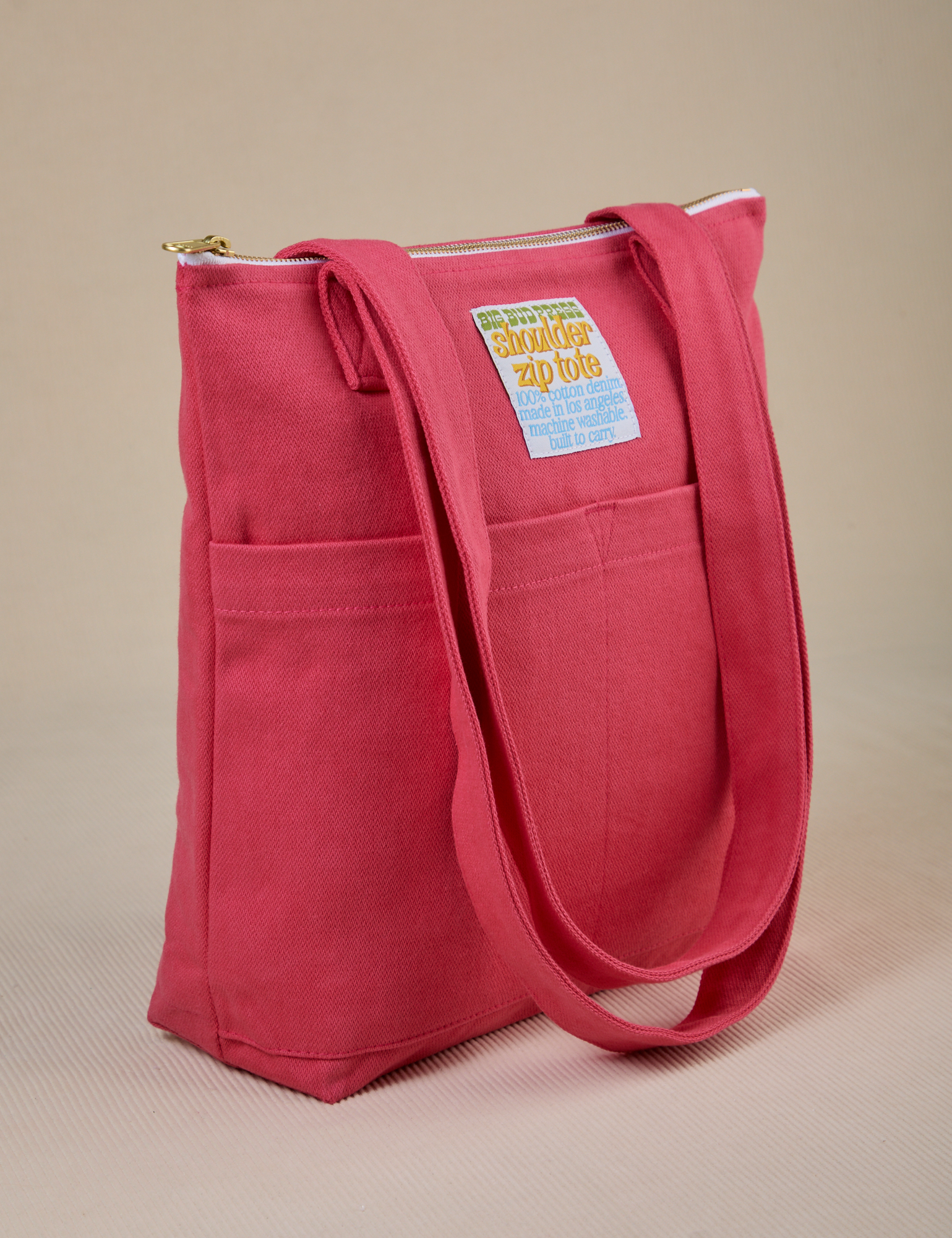 Angled view of Over-Shoulder Zip Mini Tote in Hot Pink