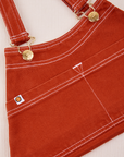 Overall Handbag in Paprika. White contrast stitching. Brass sun baby button and hardware.
