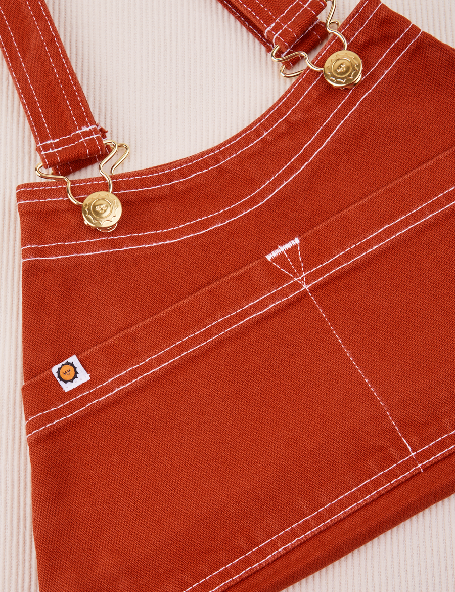 Overall Handbag in Paprika. White contrast stitching. Brass sun baby button and hardware.
