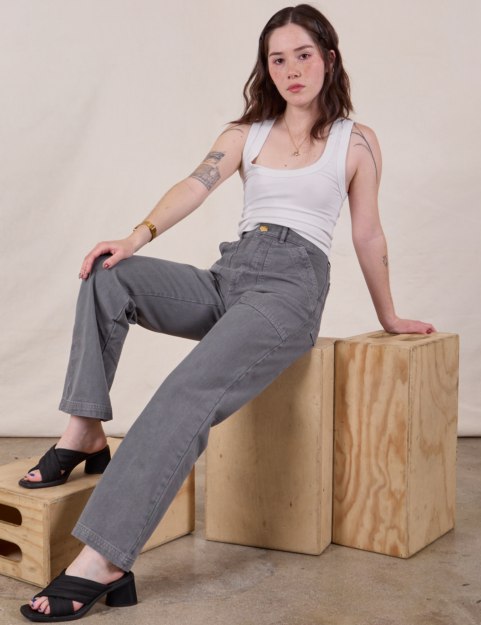 Hana is wearing Work Pants in Washed Grey and Cropped Tank in vintage tee off-white