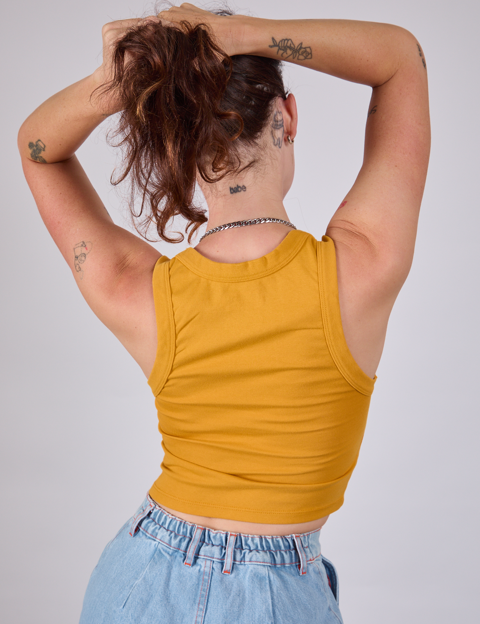 Cropped Tank Top in Mustard Yellow back view on Alex