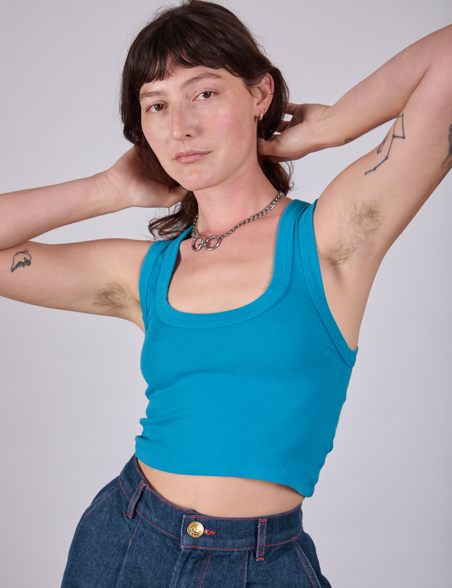 Alex is 5&#39;8&quot; and wearing P Cropped Tank Top in Hawaiian Blue