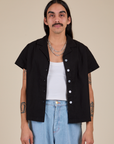 Anthony is 5’6” and wearing S Pantry Button-Up in Basic Black