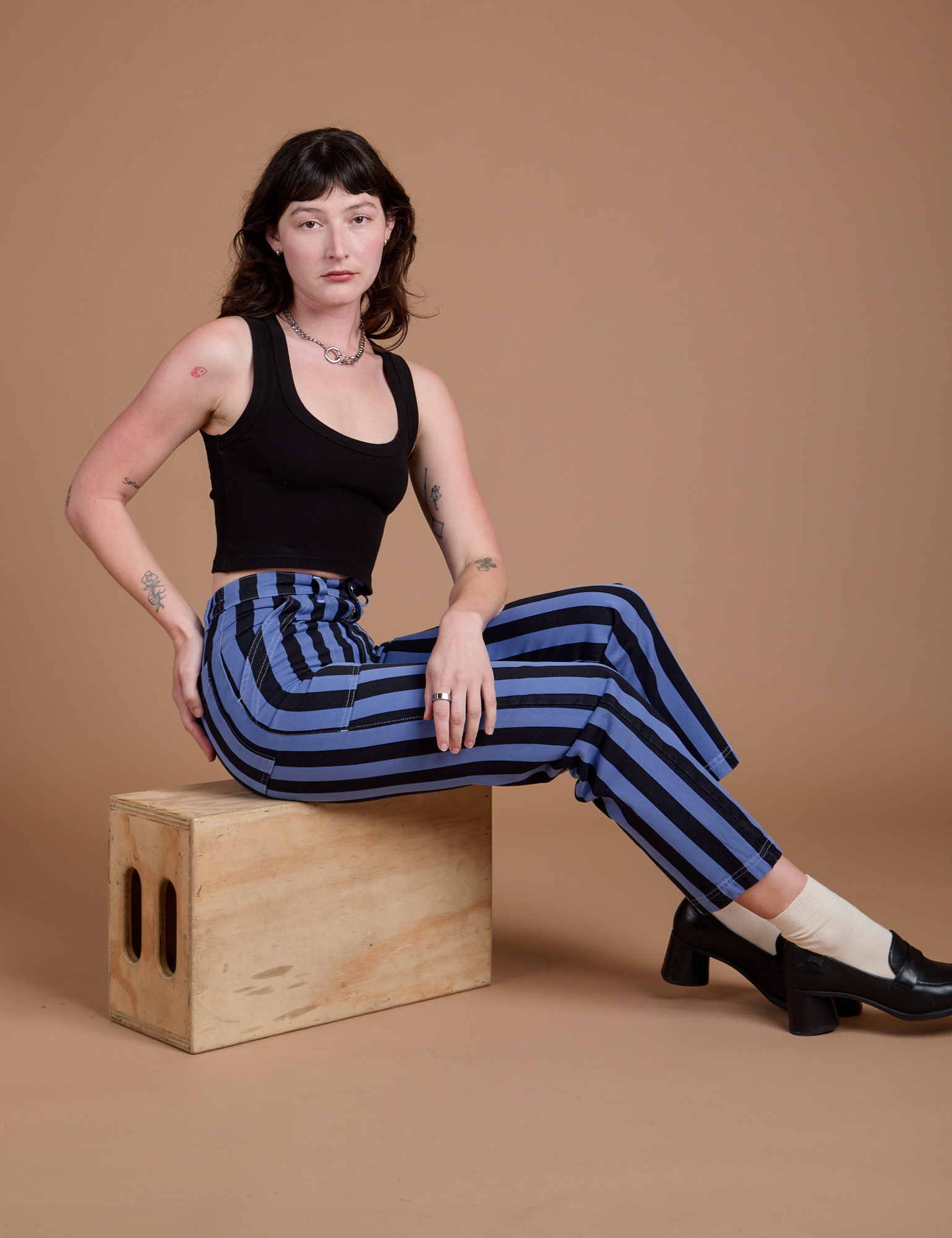 Black Stripe Work Pants in Cornflower Blue and black Cropped Tank worn by Alex